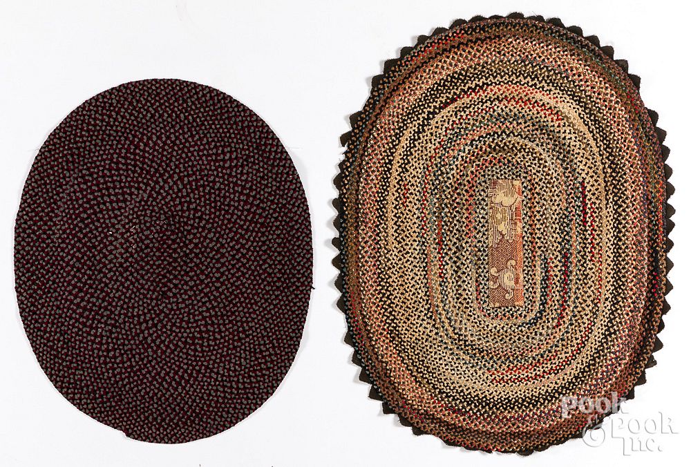 Appraisal: Two small oval braided rugs th c Two small oval