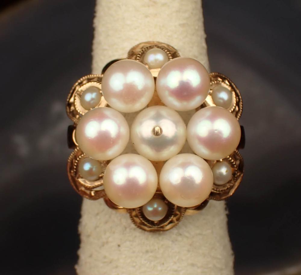 Appraisal: PEARL AND FOURTEEN KARAT YELLOW GOLD RING with six small