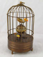 Appraisal: A bird in cage table clock with two moving birds