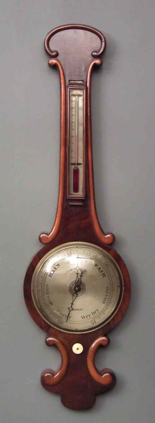 Appraisal: A Victorian mahogany cased wheel barometer and thermometer by J