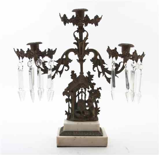 Appraisal: A Continental Three-Light Candelabrum the scrolling arms having grapevine decoration