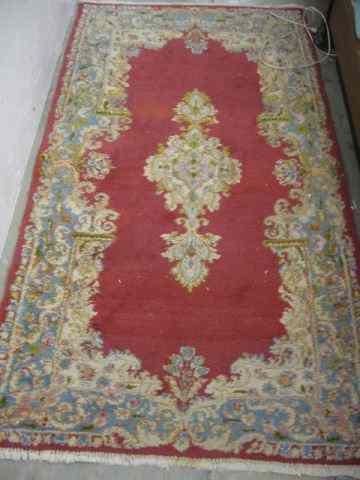 Appraisal: Kerman Persian Handmade Rug soft florals red field ' x