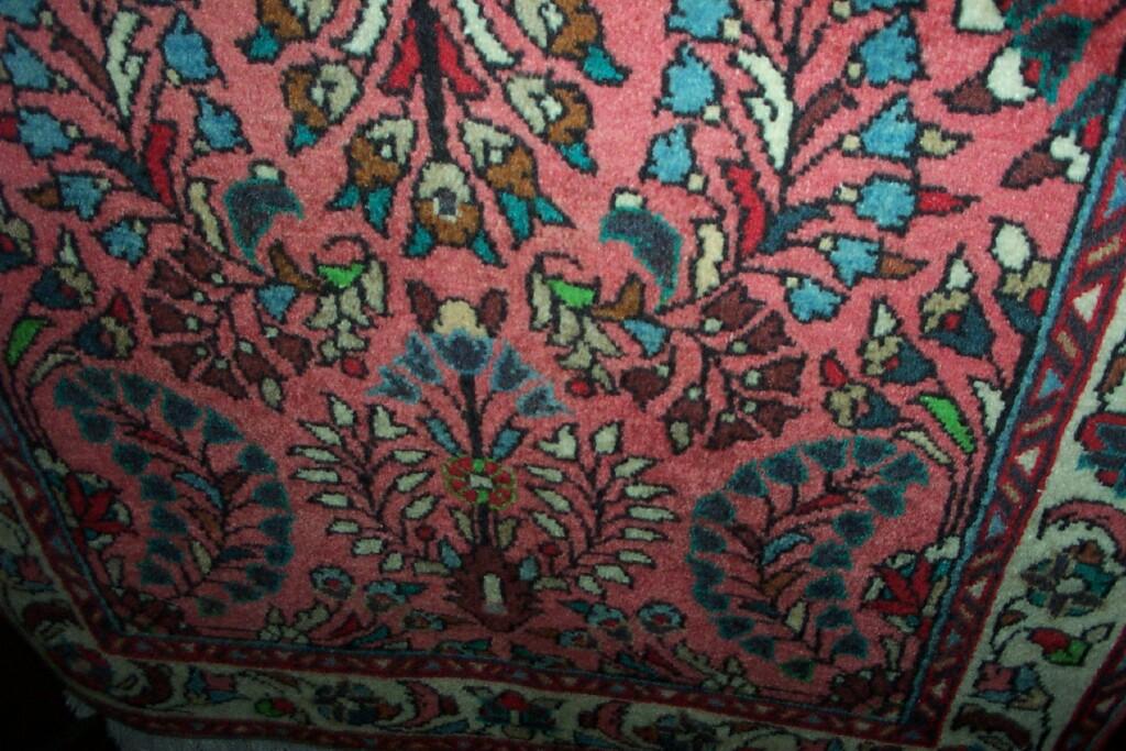 Appraisal: A small Eastern pink ground wool rug in the Persian