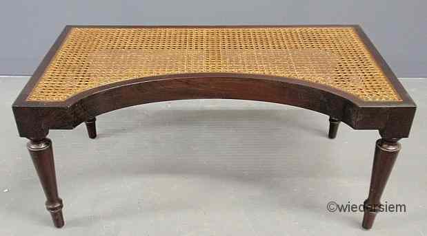 Appraisal: Sheraton style mahogany stool with a recessed curved front and