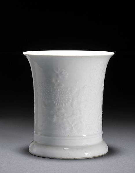 Appraisal: A molded white porcelain brush pot with floral decoration th