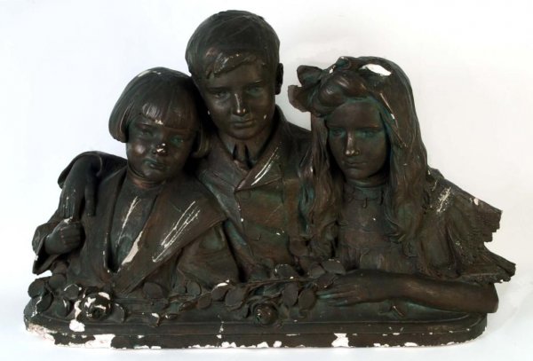 Appraisal: A large black painted plaster sculpture of three children from