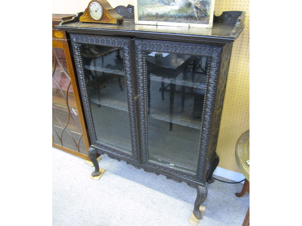 Appraisal: Anglo Indian carved hardwood glazed door bookcase