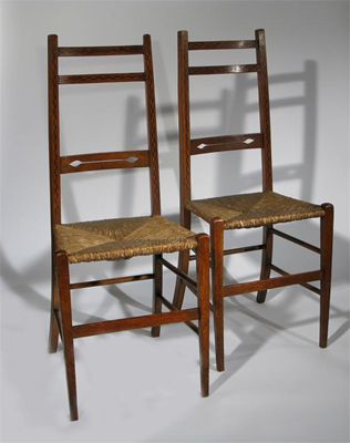 Appraisal: A pair of Heal Co oak chairs rush seat the