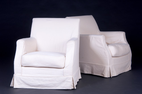 Appraisal: CHRISTIAN LIAGRE Pair of club chairs fully upholstered in white