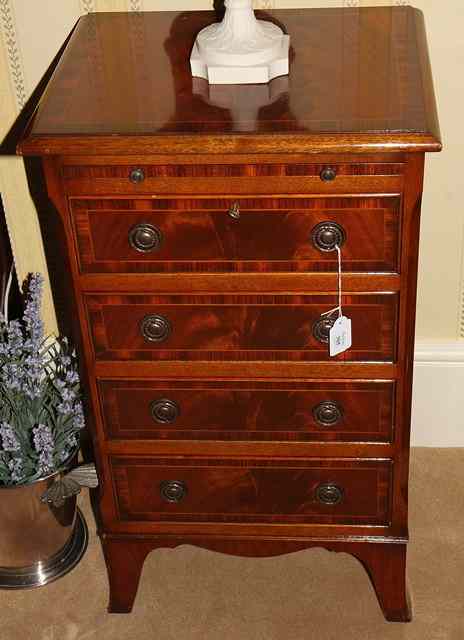 Appraisal: A SMALL MAHOGANY AND WALNUT CROSS BANDED CHEST with a