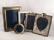 Appraisal: Five silver photo frames all strut backed one heart shaped