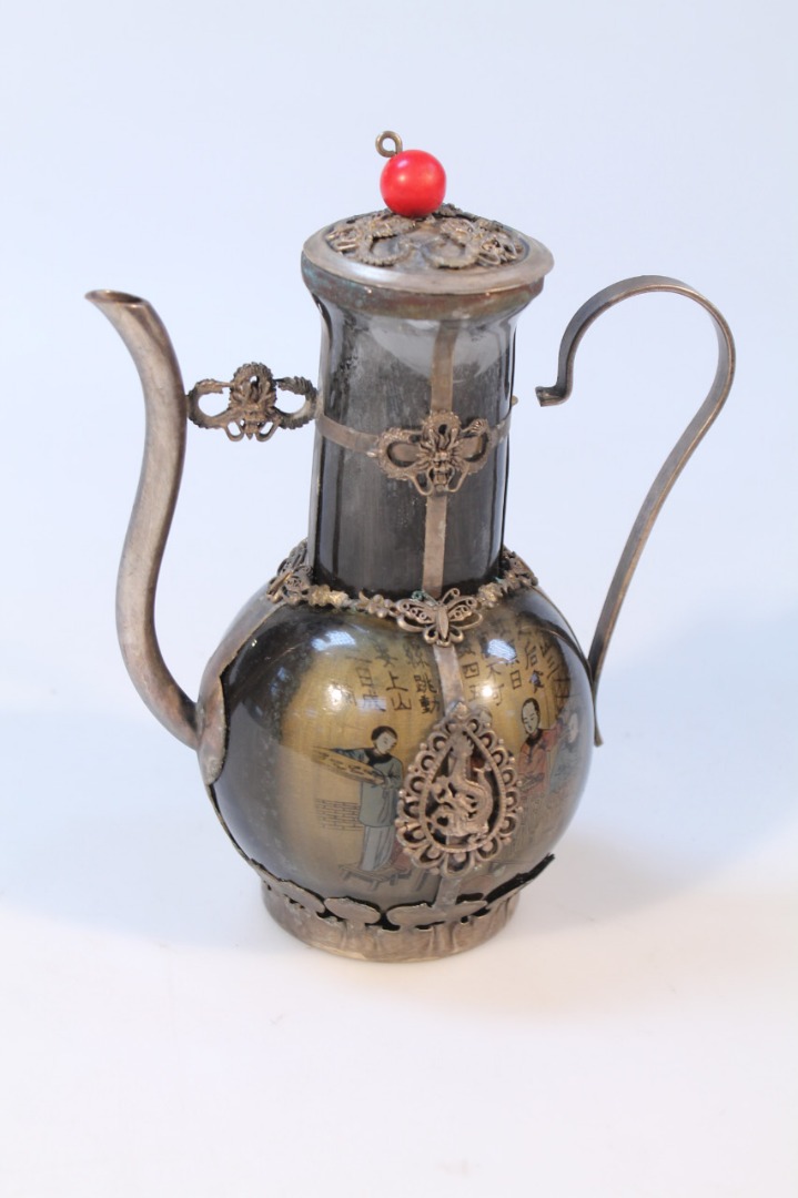 Appraisal: A Chinese Qing style coffee pot with a white metal