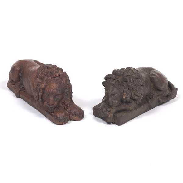 Appraisal: NEAR PAIR OF CAST COMPOSITE RECUMBENT LIONS x x Warm