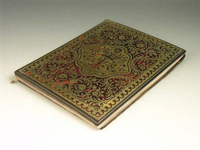 Appraisal: A th century ebonised tortoiseshell and cut brass blotter with