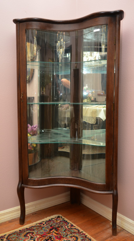 Appraisal: CONCAVE CURVED GLASS CORNER CURIO CABINET Unique concave curved glass