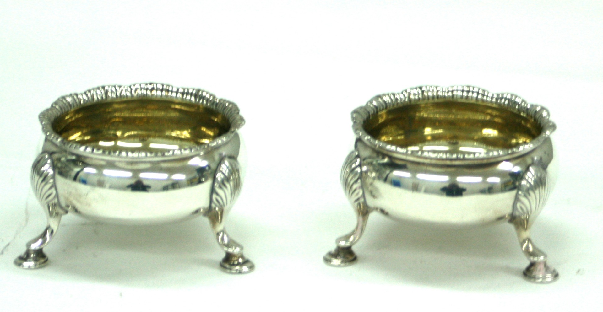 Appraisal: A pair of George III silver cauldron salt cellars D