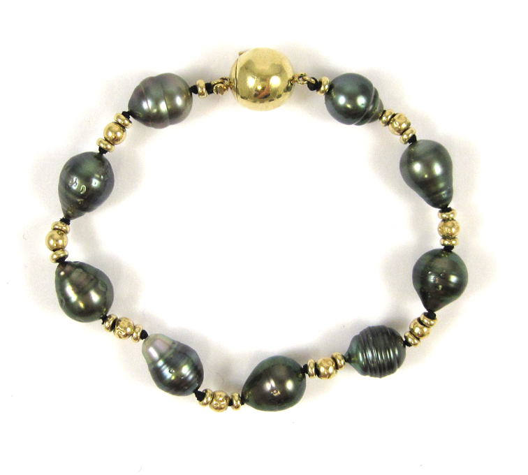 Appraisal: BLACK PEARL AND FOURTEEN KARAT GOLD BRACELET measuring inches in