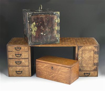 Appraisal: A Japanese parquetry travelling desk with drawers and a cupboard