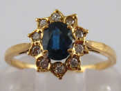 Appraisal: A yellow metal tests carat gold sapphire and diamond ring