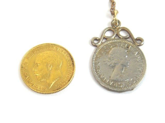 Appraisal: A George V half sovereign a farthing pendant and a