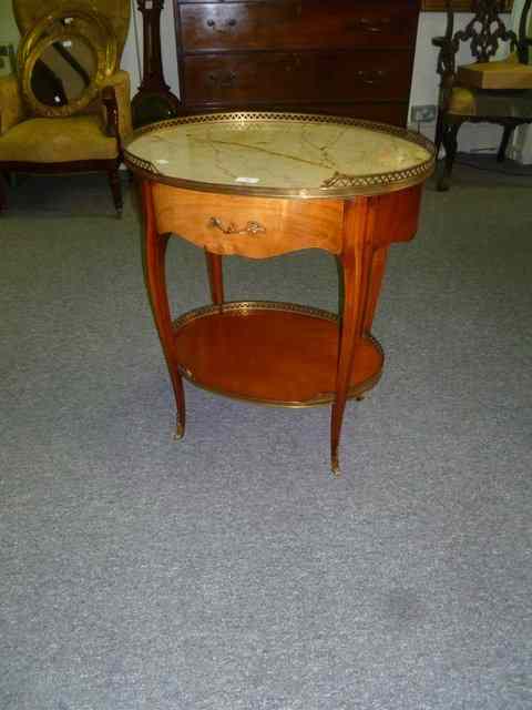 Appraisal: A FRENCH WALNUT OCCASIONAL TABLE of oval form with undergallery