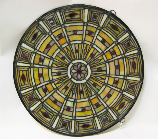 Appraisal: PAIR ROUND STAINED AND LEADED GLASS WINDOW PANELS Spokes emanate