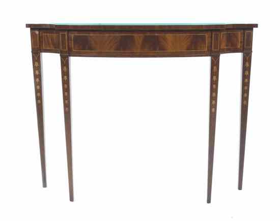 Appraisal: A Console Table Wellington Hall having a shaped top over