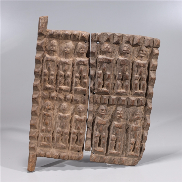 Appraisal: African carved wood Dogon door panel with repeating figure design