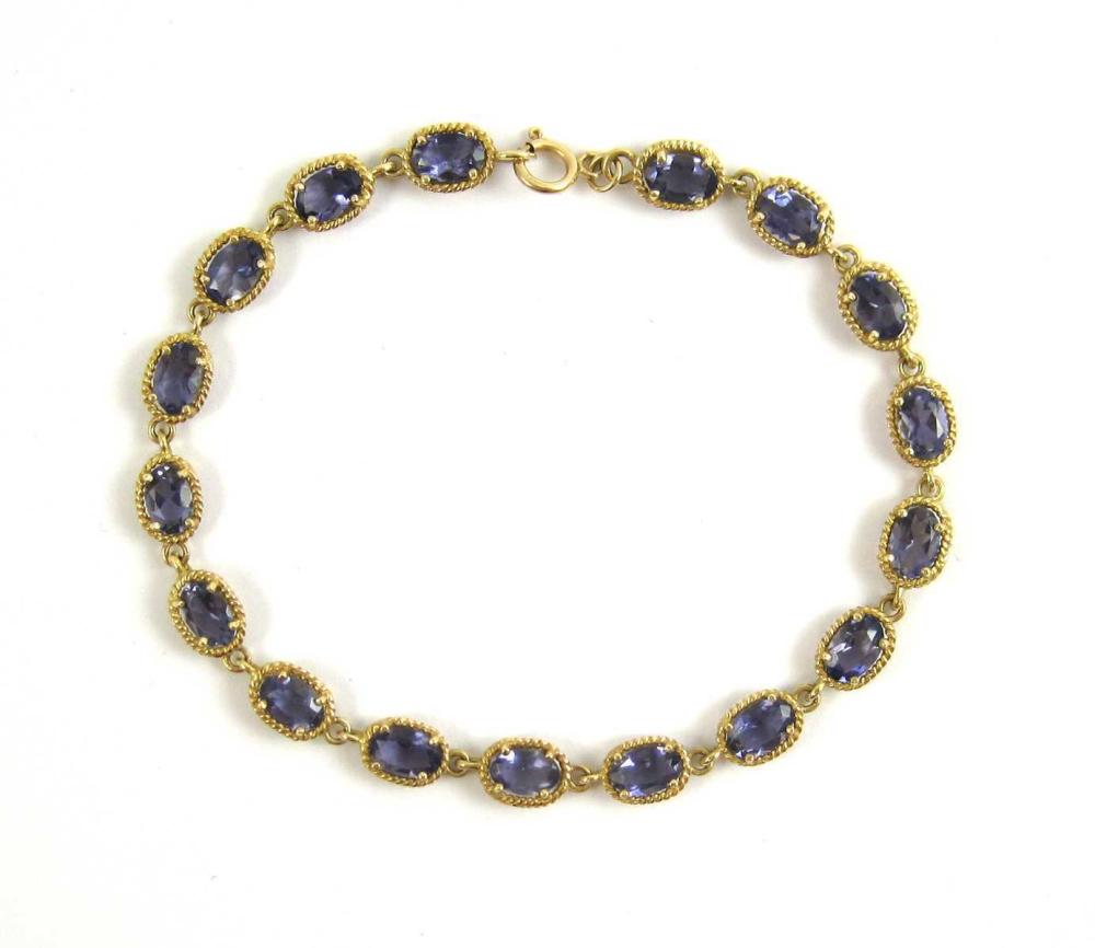 Appraisal: TANZANITE AND FOURTEEN KARAT GOLD BRACELET with oval shaped gold