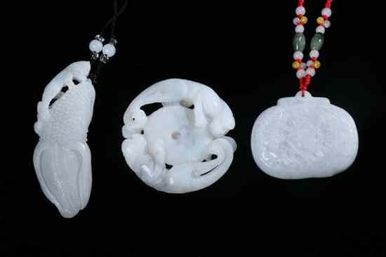 Appraisal: THREE CHINESE GREYISH WHITE JADE PENDANTS Carved with calligraphy dragon