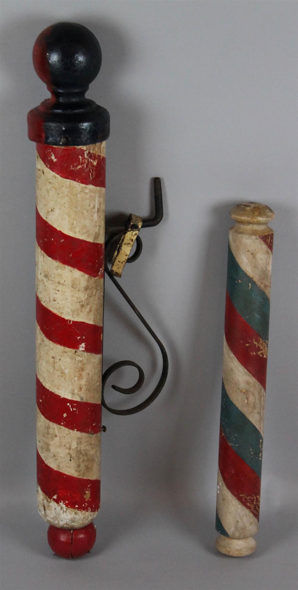 Appraisal: TWO PAINTED BARBER'S POLES ONE WITH CAST IRON FINIAL AND