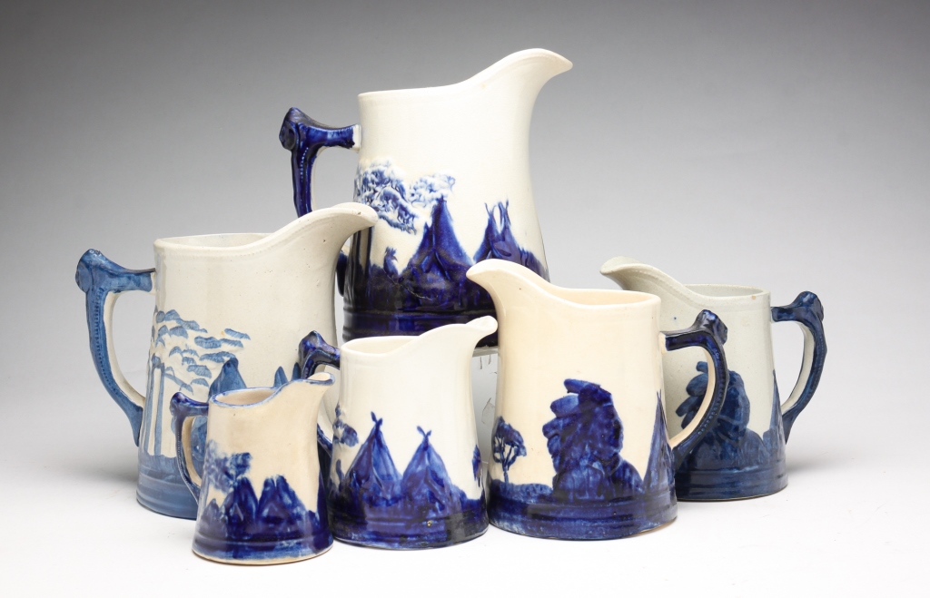 Appraisal: SIX SLEEPY EYE PITCHERS Ca Cobalt and white with Native