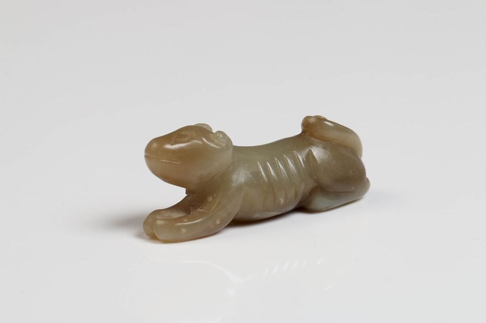 Appraisal: CELADON JADE DOG POSSIBLY SONG YUAN The stone of an