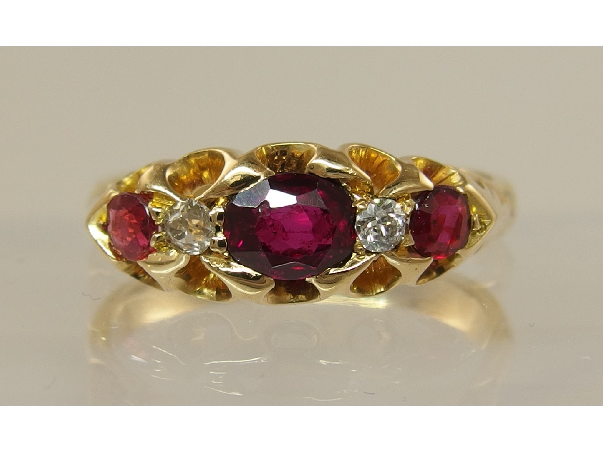 Appraisal: An ct Edwardian diamond and red gem stone ringwith galleried