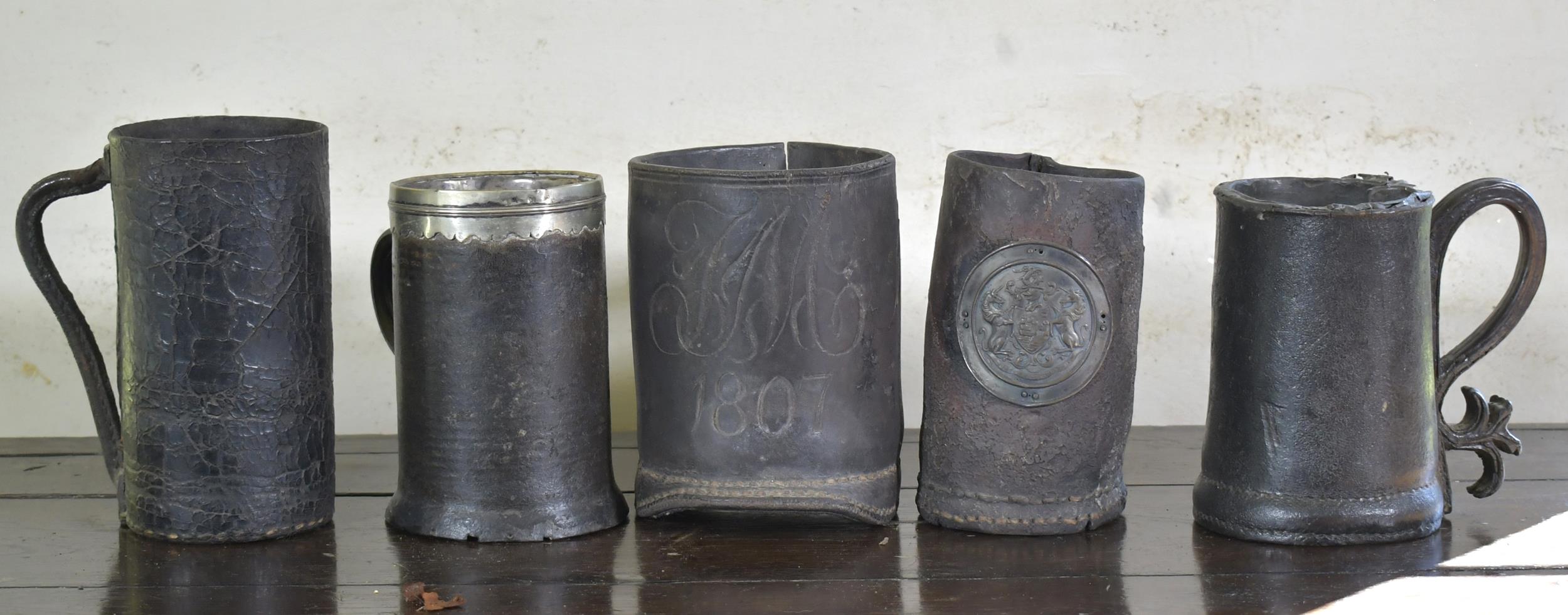 Appraisal: FIVE EARLY LEATHER MUGS BLACKJACKS Good collection of five th