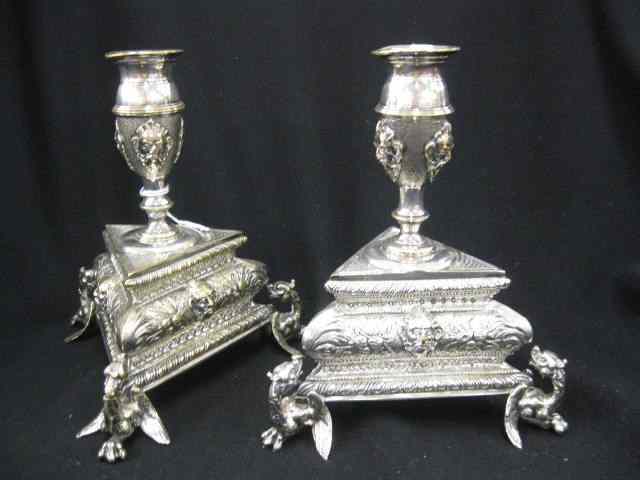 Appraisal: Pair of Silverplate Candlesticks triangular footed bases with gryphons faces