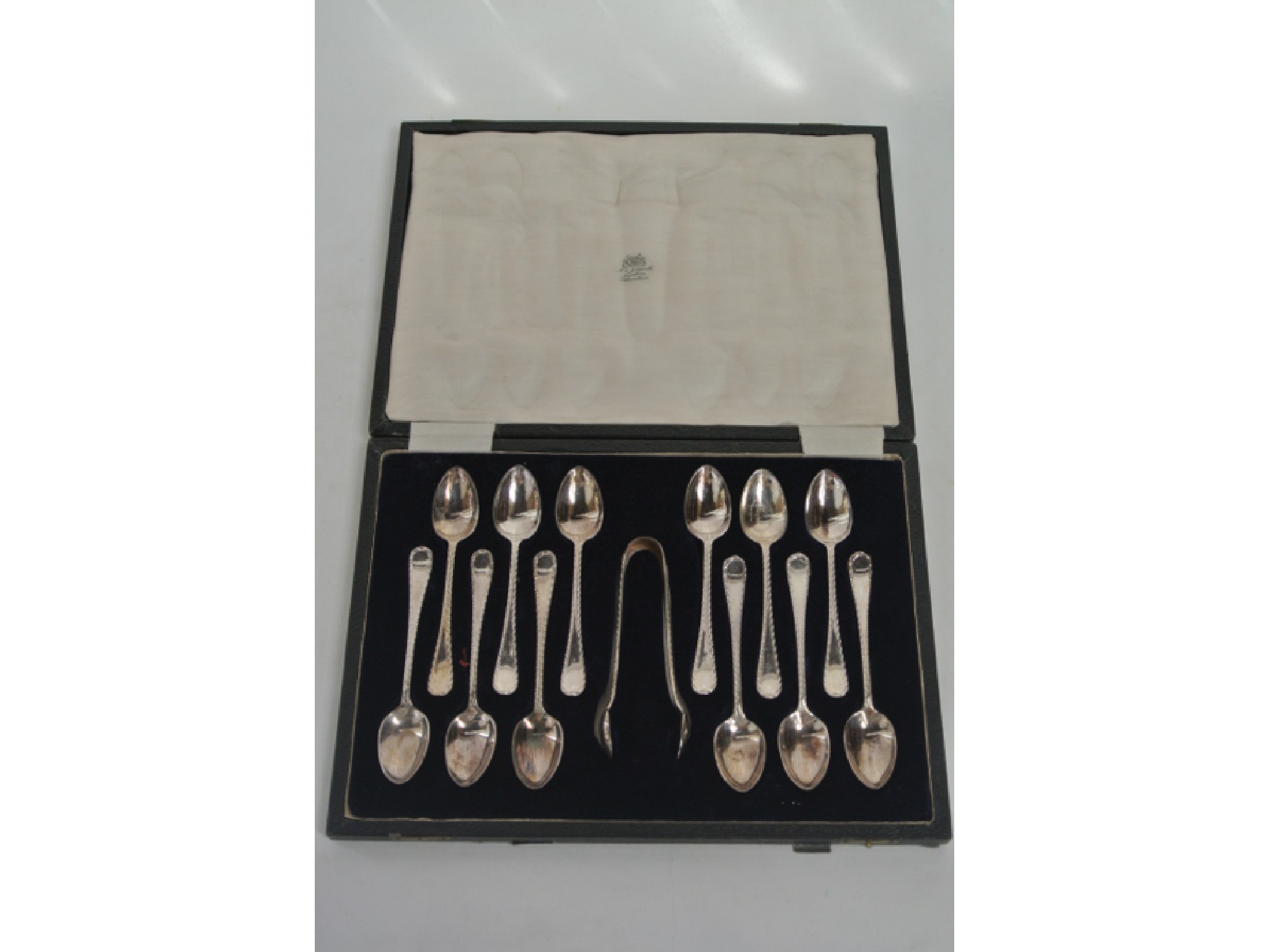 Appraisal: A cased set of twelve Victorian silver plated teaspoons and