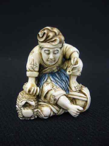 Appraisal: Carved Ivory Netsuke of a Man with pipe seated on