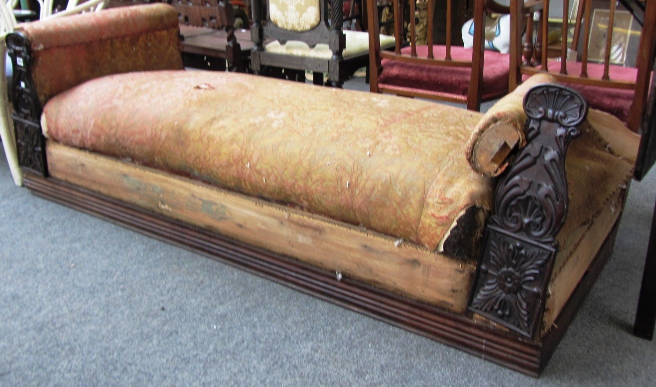 Appraisal: An early th century French rosewood day bed with carved