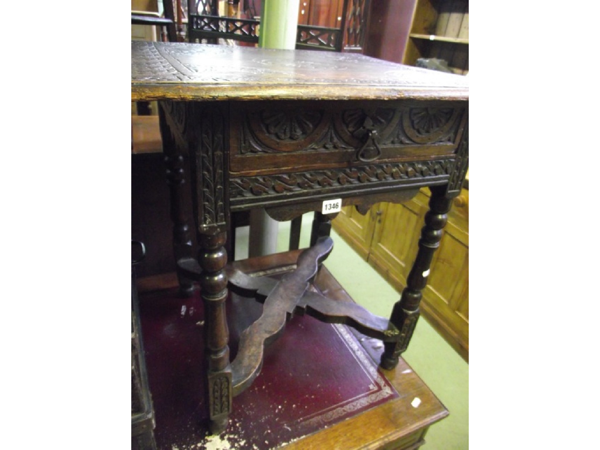 Appraisal: A Victorian oak occasional table with carved foliate and further