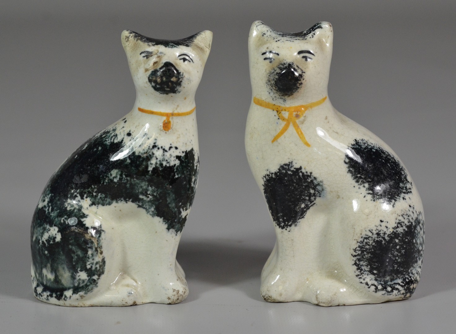 Appraisal: Pair of Staffordshire cats - high repair to ears of