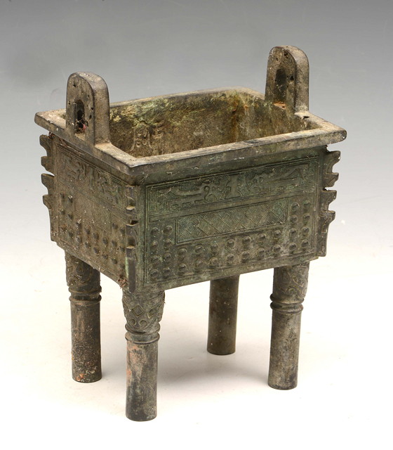 Appraisal: A CHINESE BRONZE FOUR LEGGED T'ING in the Zhou style