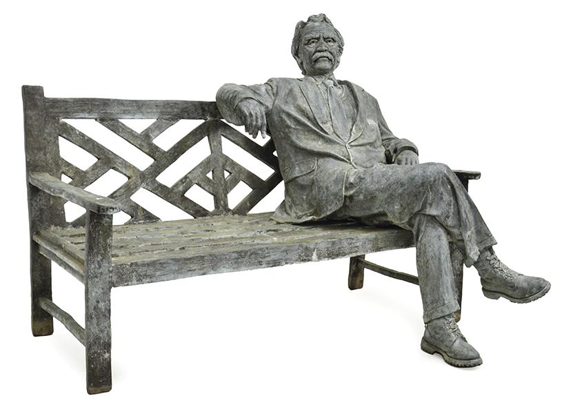 Appraisal: A LIFE SIZE PATINATED BRONZE FIGURE GROUP DEPICTING A MAN