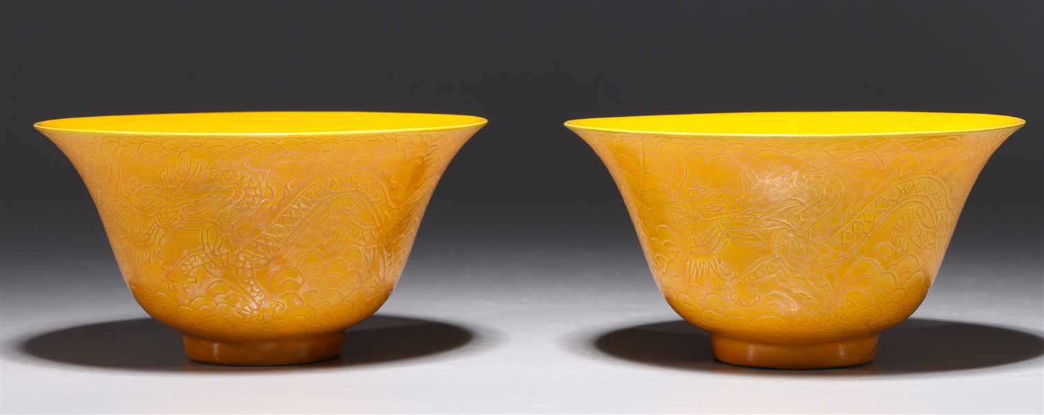 Appraisal: Two Chinese yellow ground porcelain bowls each with incised dragon