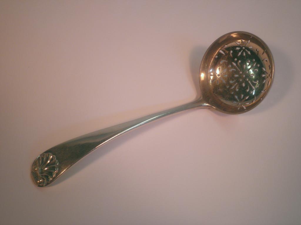 Appraisal: An Edward VII silver sifter spoon with a circular pierced