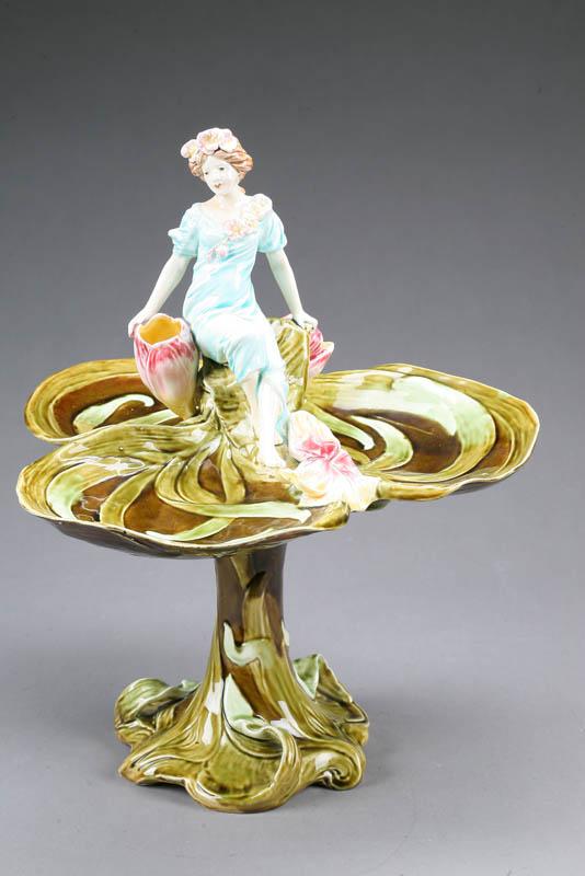 Appraisal: MAJOLICA COMPOTE Three well clover shaped compote with a lady