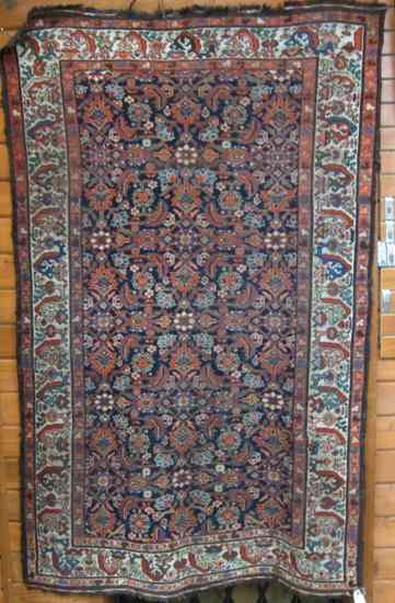 Appraisal: ANTIQUE PERSIAN TRIBAL AREA RUG overall stylized floral design on