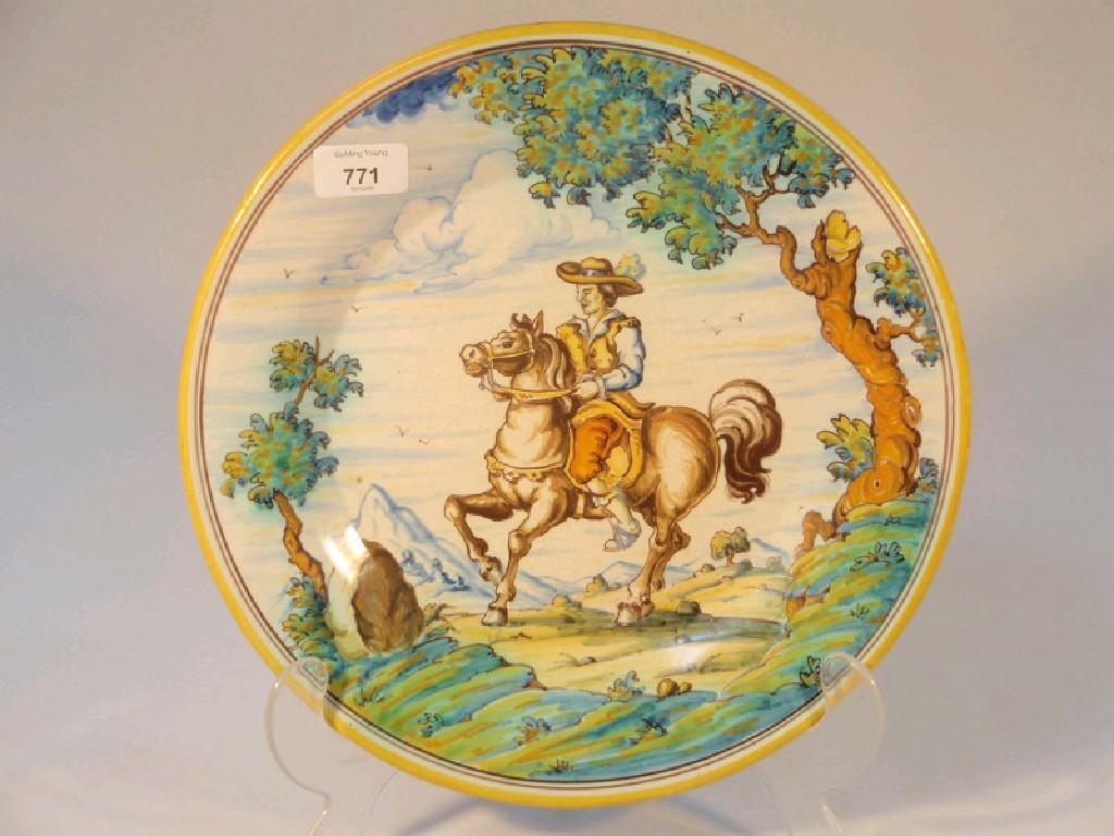 Appraisal: A modern Spanish majolica plate painted with Don Quixote on