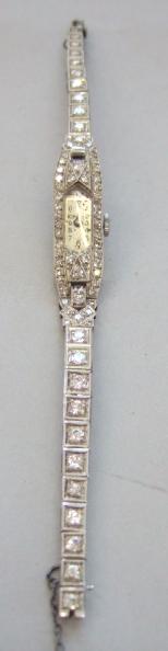 Appraisal: A lady's diamond set platinum cased dress wristwatch with a