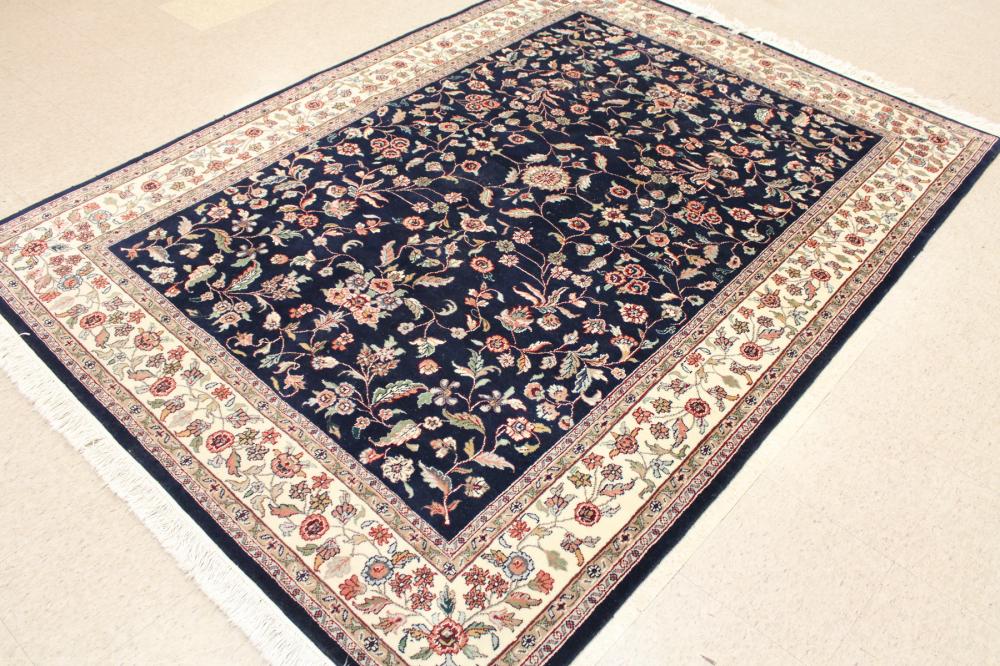 Appraisal: HAND KNOTTED ORIENTAL CARPET Indo-Persian overall floral design on dark